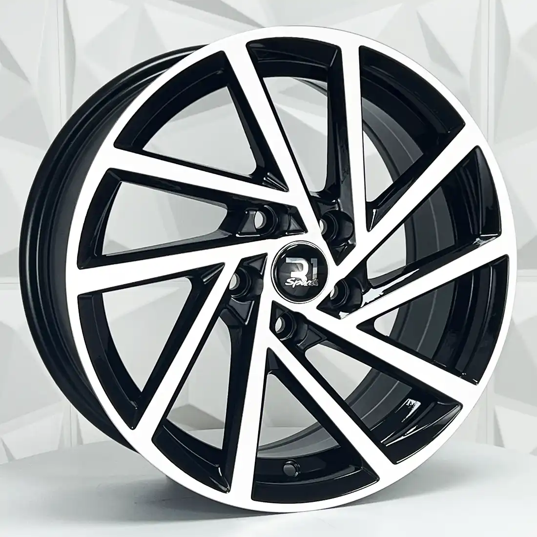 Rin 151538 RIN 15X6.5 5-100 R1 SPORT DX345 BLACK MACHINE FACE ET30 CB73 5-100 con barrenación 5-100